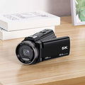 Black 5k digital outdoor sports camera with 48mp resolution optical zoom lens and sleek matte finish design