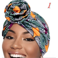 Vibrant printed headband elastic set featuring a colorful orange green and purple african print headwrap styled in a decorative knot