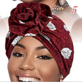 A vibrant printed headband elastic set featuring a rich maroon headwrap with white leaf pattern tied in an elegant knot