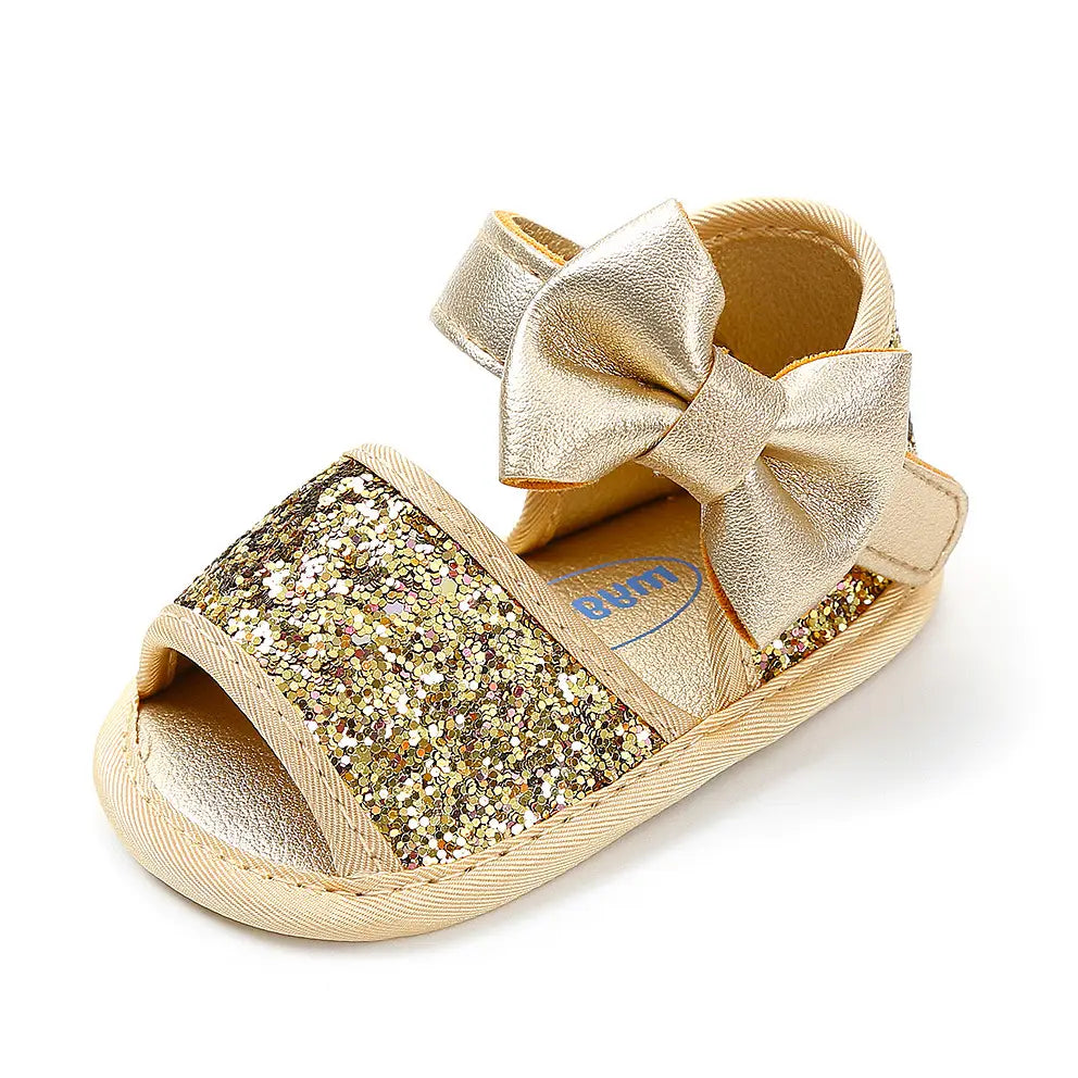 gold sequined baby shoes princess sandals featuring gold glitter and a matching metallic bow for elegant princess shoes sandals.