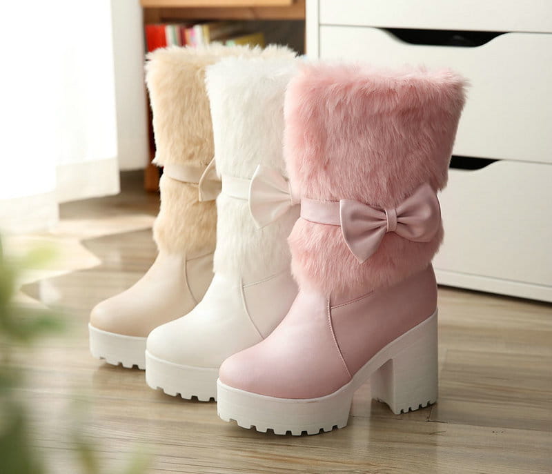 White platform sweet bow boots featuring pink faux fur lining and a matching satin snow sweet bow heel.
