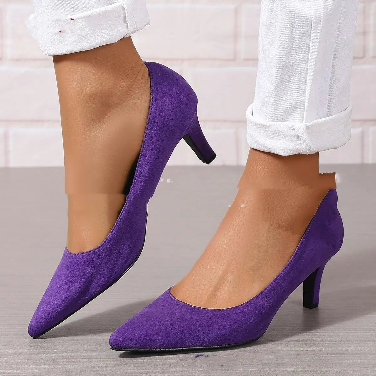 Purple suede pointed toe ladies stiletto heel pumps with a black stiletto heel for fashion ladies stiletto style.