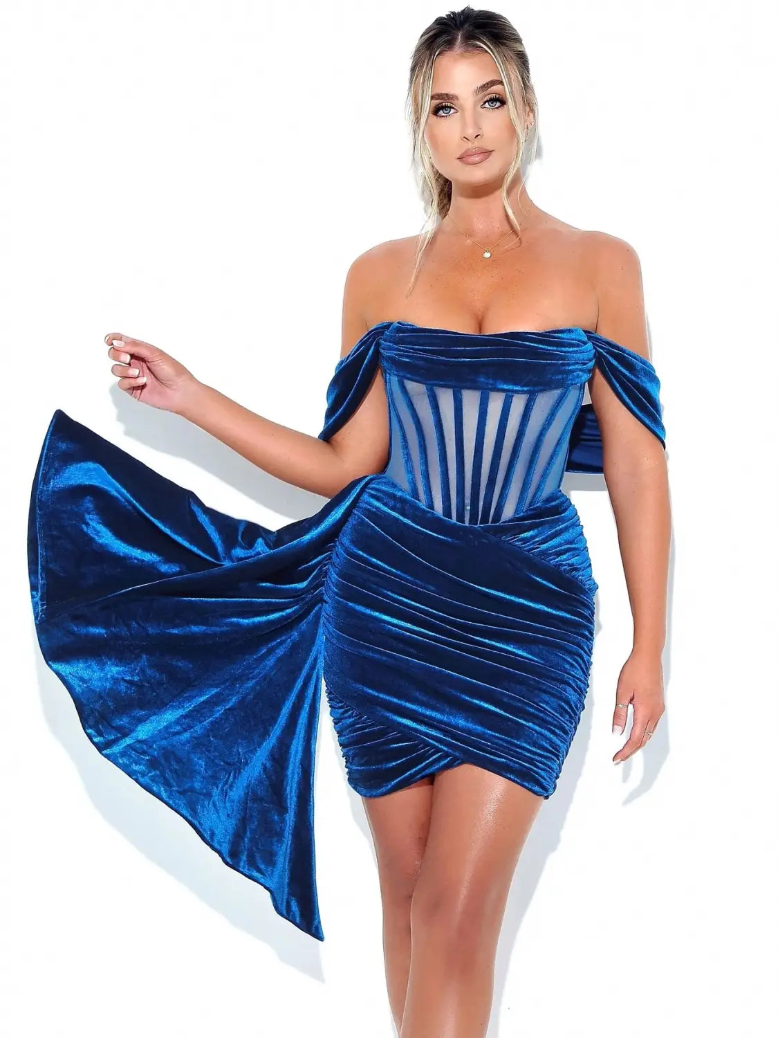 A striking royal blue velvet off the shoulder mini dress with a corset style bodice and flowing draped sleeves perfect as a breast sexy evening dress.