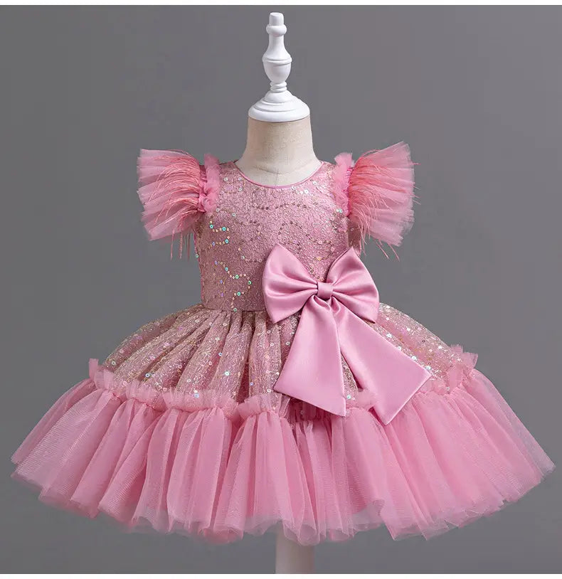 Pink sequined toddler dress with tulle ruffles and satin bow showcasing a dress tulle skirt summer style suitable for wedding dress tulle occasions.
