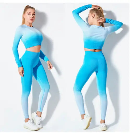 A vibrant blue seamless gradient long sleeve women’s seamless gradient yoga set featuring a crop top and high-waisted leggings made from stretchy performance fabric.