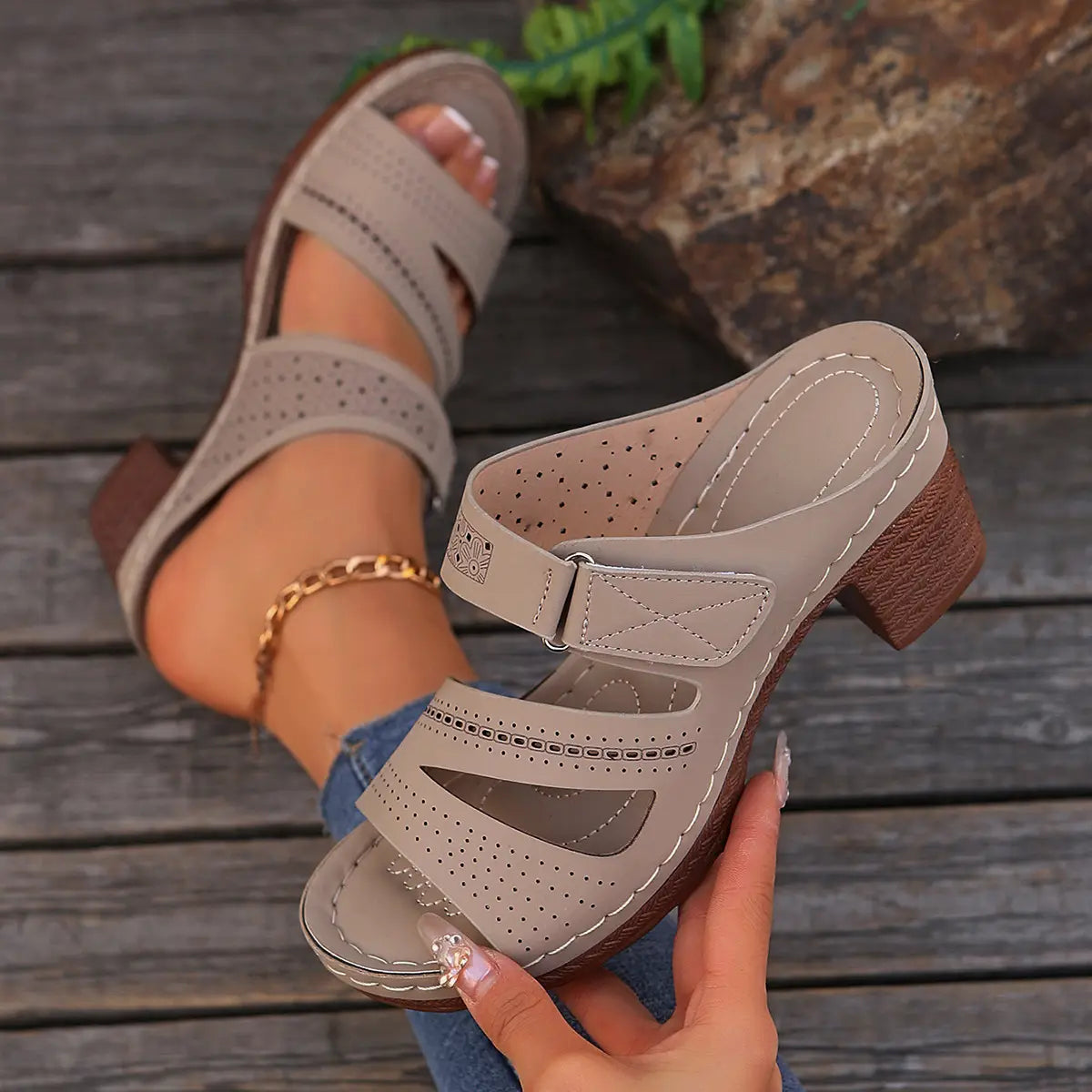 Beige leather mule sandals with perforated detailing and a chunky brown heel perfect for summer casual chunky wear.