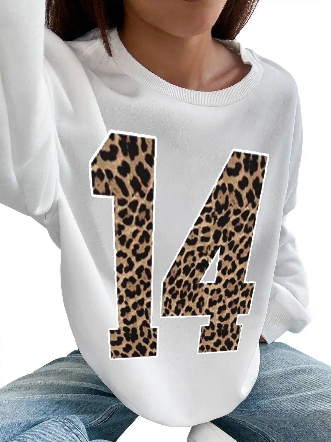 white crew neck sweatshirt featuring a bold black leopard-print number 14 on the front