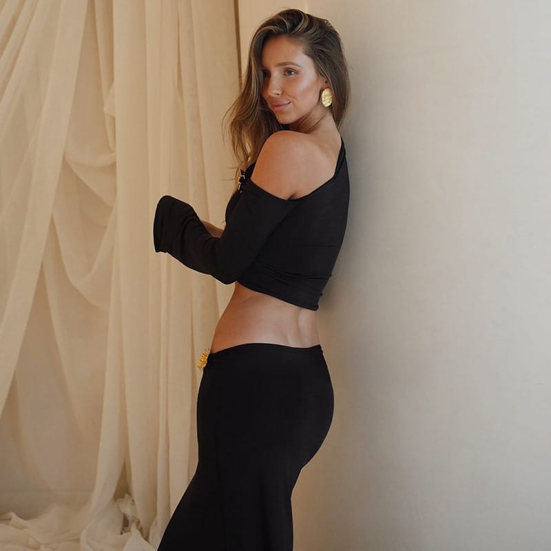 black off-the-shoulder crop top with long bell sleeves featuring a sexy slim oblique shoulder design suitable for elegant occasions