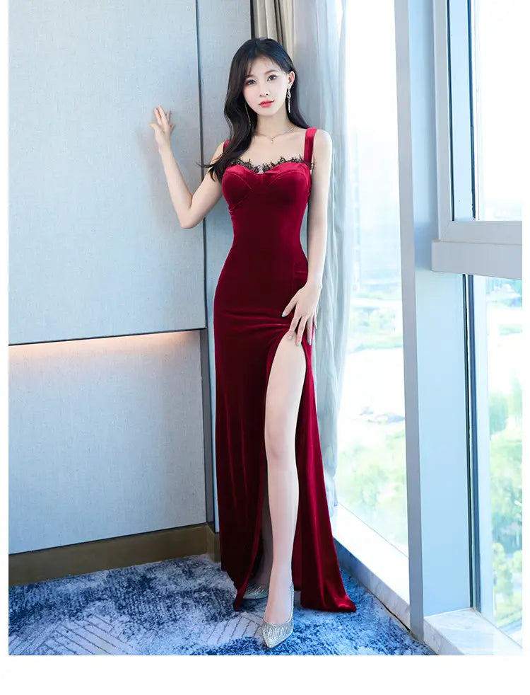 a deep red velvet lace wrap hip evening dress featuring a sweetheart neckline with lace trim thin straps and a high slit