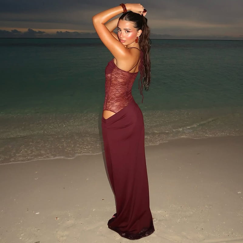 a burgundy satin y2k lace suspender dress featuring a lace bodice and a satin skirt with a side cutout detail