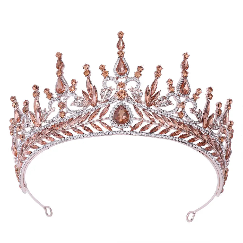A rose gold tiara with peach-colored teardrop crystals and clear rhinestones in an elegant leaf motif design for wedding headwear hair hoop.