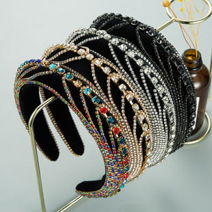 a collection of elegant baroque colorful headbands in black and silver featuring sparkling gemstones and colorful rhinestone accents