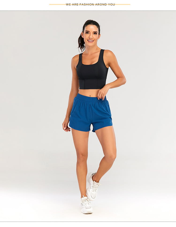 A pair of vibrant royal blue summer sports shorts with zipper pockets breathable lightweight fabric and a comfortable elastic waistband.