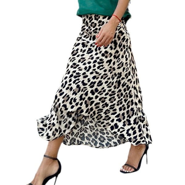 A flowing white and black leopard print elastic a line skirt with a ruffled hem and midi length.
