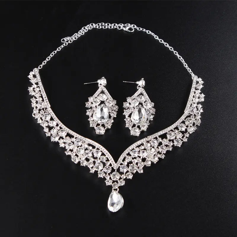 silver rhinestone alloy diamond accessories jewelry set featuring a teardrop pendant necklace and matching drop earrings with intricate crystal detailing