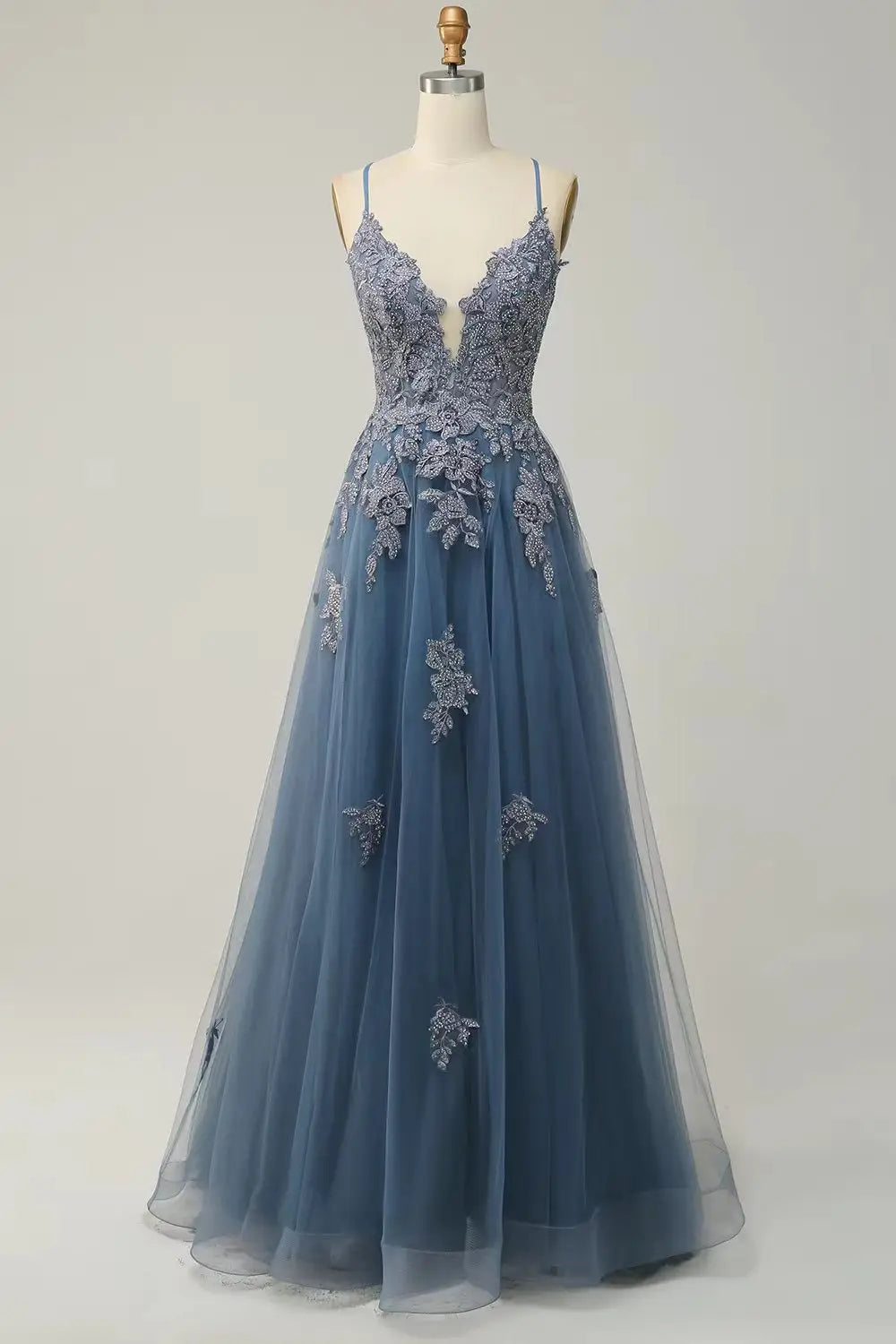 A delicate navy blue tulle women evening dress with intricate silver floral embroidery displayed on a mannequin for formal occasions.