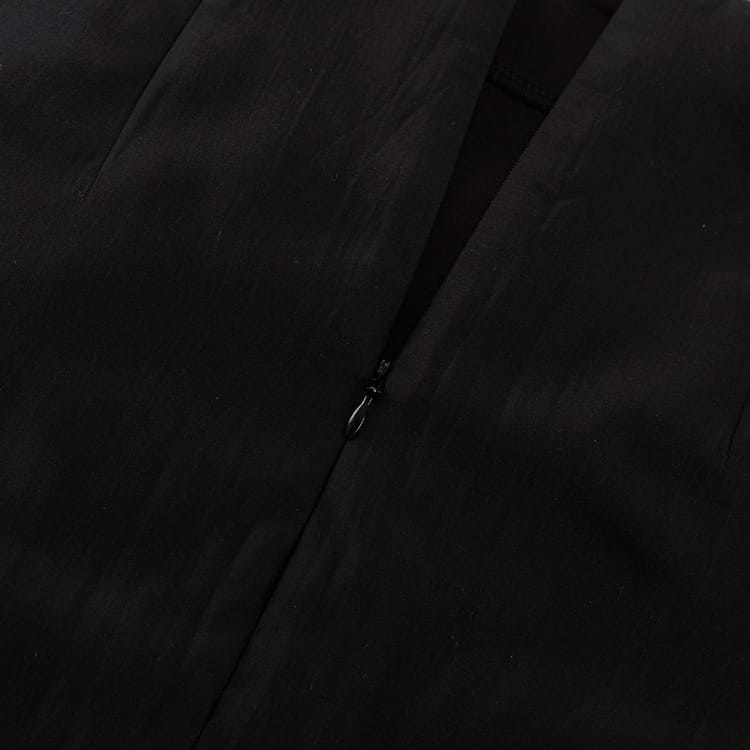 black sheer high waist slit sheath skirt featuring a central zipper closure on black fabric garment