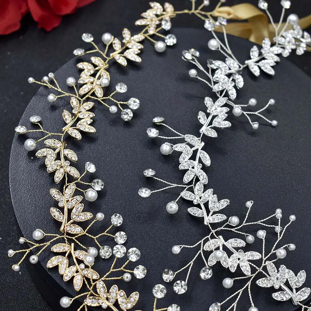 Elegant silver leaf bridal hair band with gold and silver vine design adorned with sparkling hair band rhinestone crystals, faux pearls, and band rhinestone alloy leaves.
