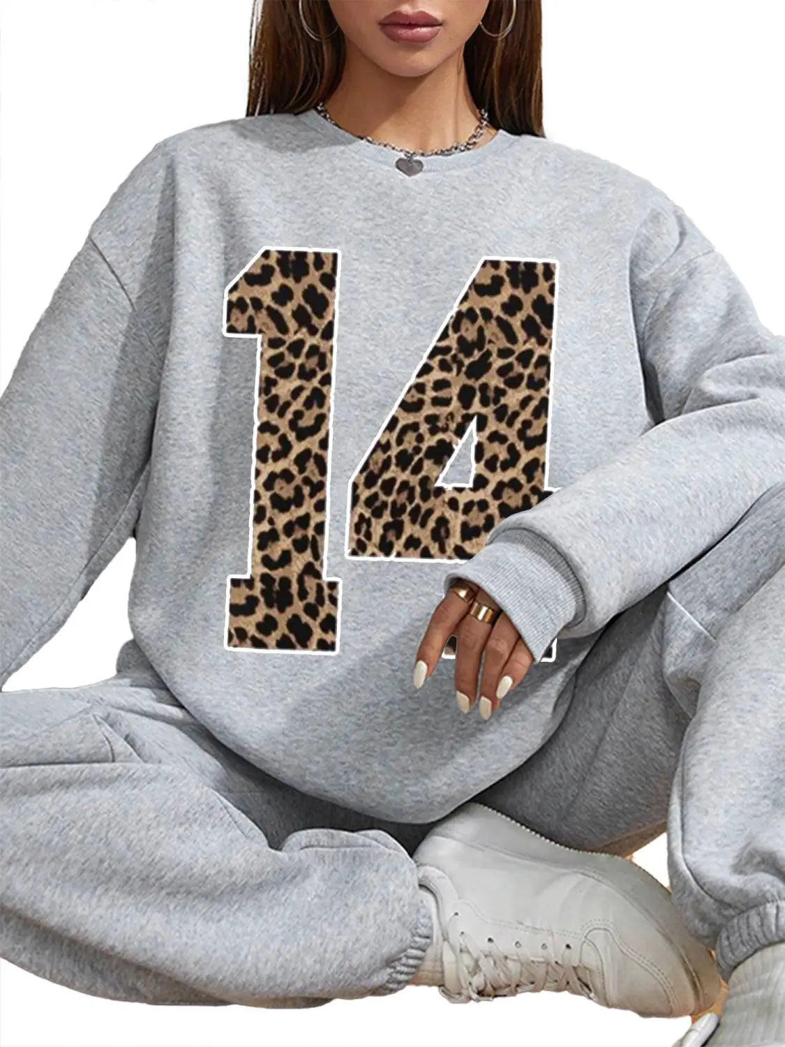 Gray crew neck sweatshirt featuring a bold black leopard print number 14 on the front.