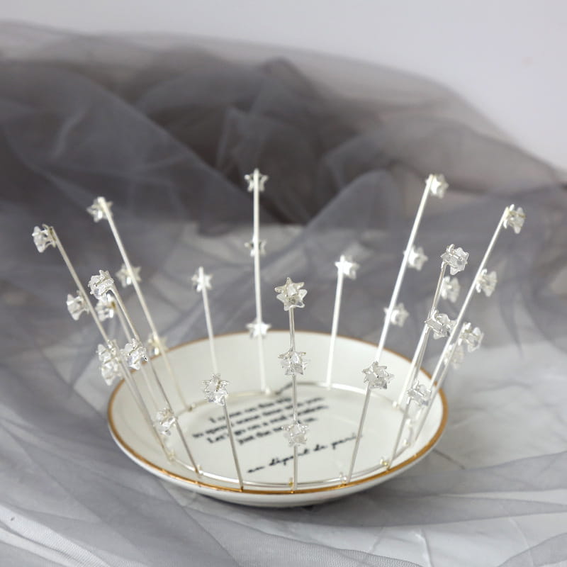 A delicate silver star tiara with clear crystal accents designed as wedding jewelry handmade for bride wedding jewelry and jewelry handmade star headwear.