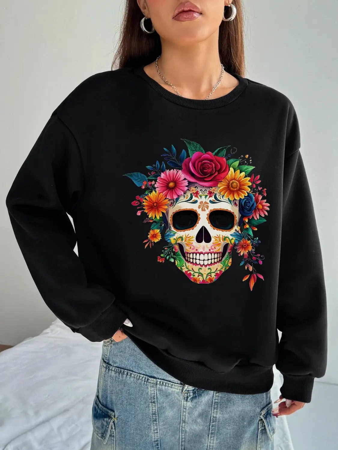 Black crew neck sweatshirt for daily wear featuring a vibrant colorful floral skull design and basic long sleeve style.