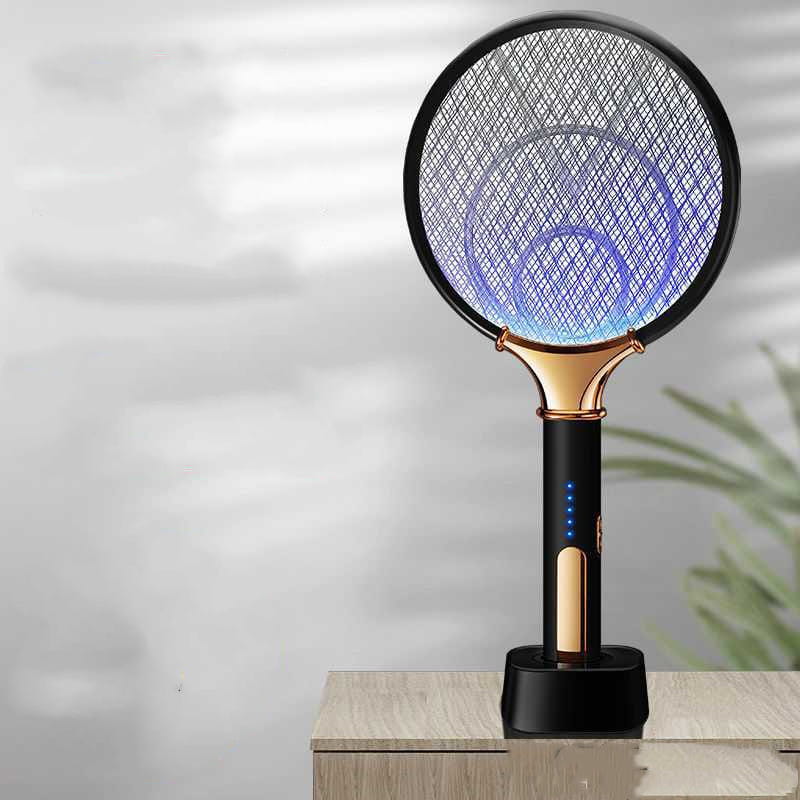 Black and gold electric mosquito swatter with a glowing blue mesh head designed for efficient use as a modern home bedroom electric mosquito control device.