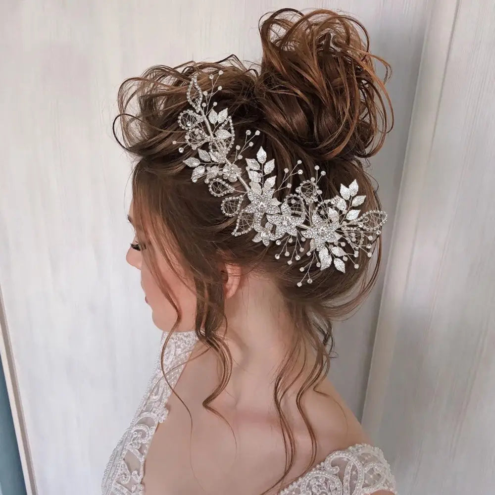 A delicate handmade environmentally friendly silver floral headpiece made from an environmentally friendly alloy adorned with sparkling rhinestones and tiny pearls.