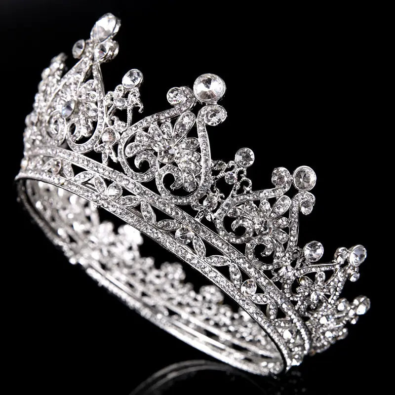 a sparkling silver rhinestone big european princess crown hair featuring intricate floral and scrollwork designs embellished with numerous clear crystals for american princess crown style.