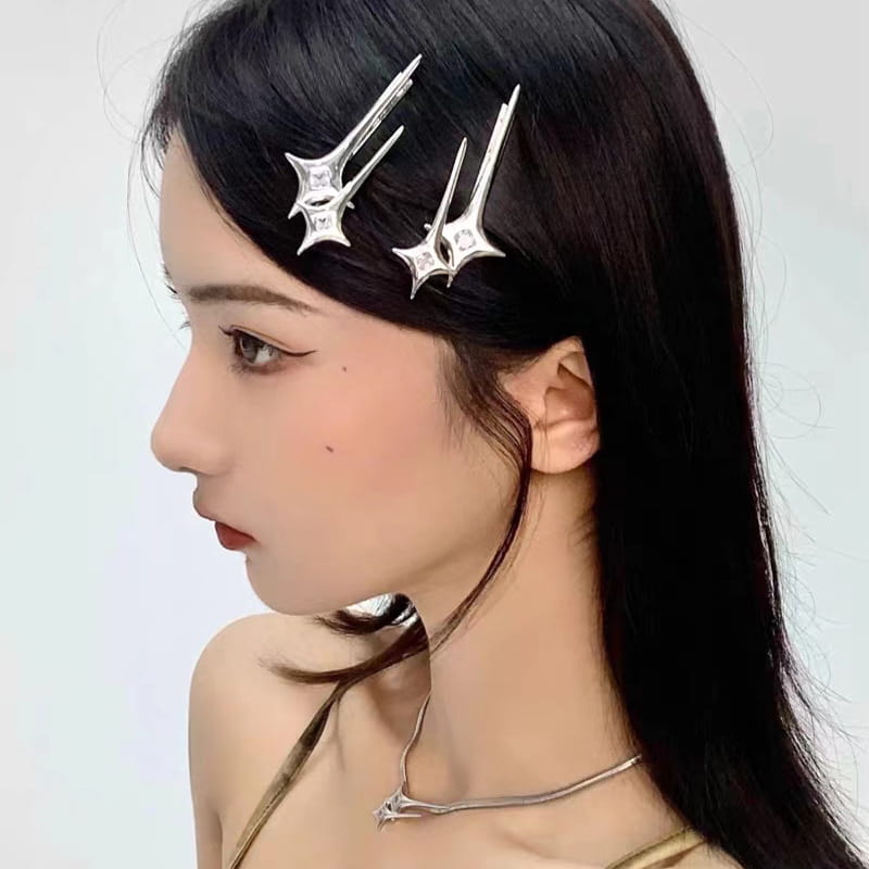 Silver star y2g star hairpin features silver star-shaped clips with sharp angular points and embedded clear gemstones for a hot girl y2g look.