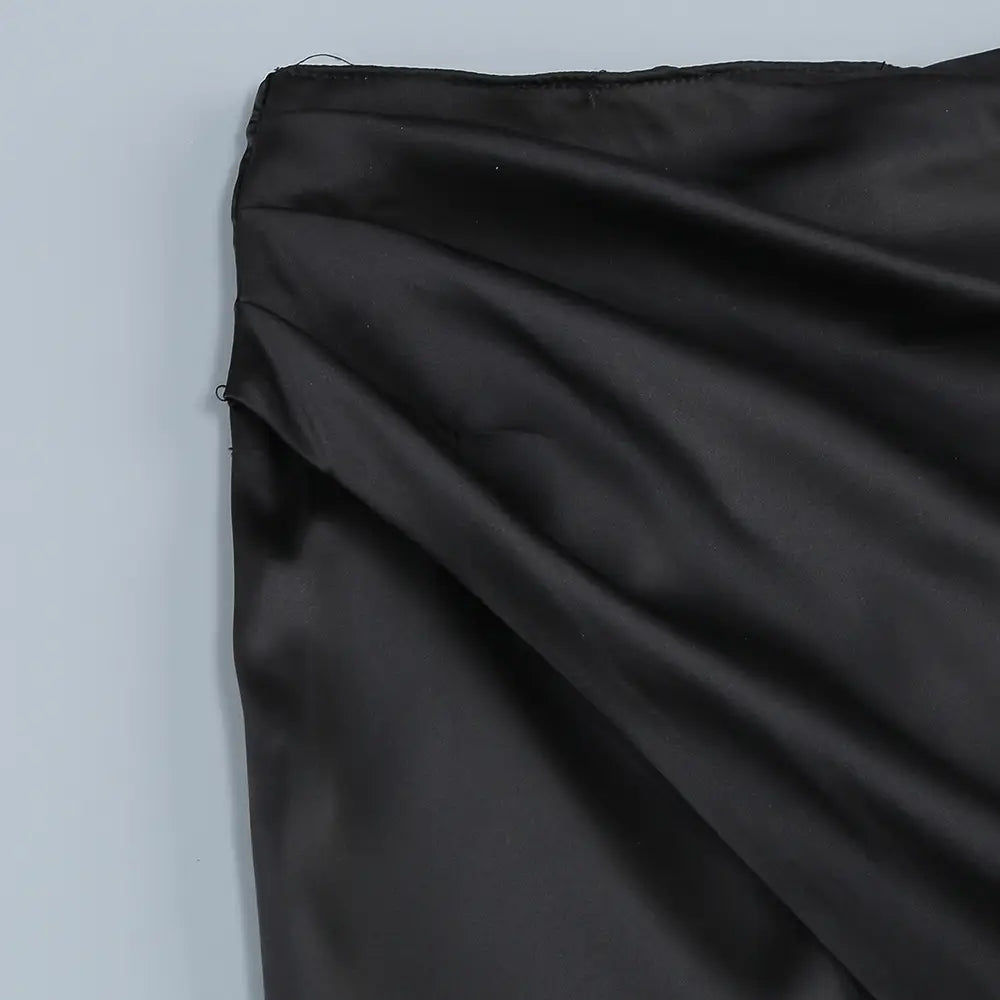 black satin fabric with smooth glossy finish and subtle sheen featured in one-shoulder slit mop black dress two-piece set with set sexy lacing design