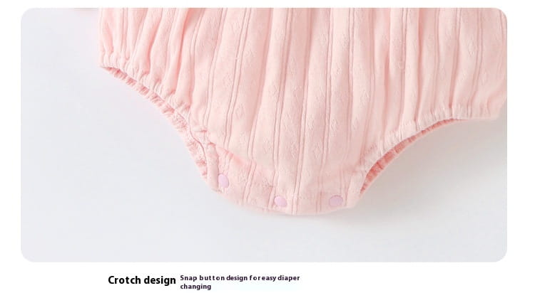 Pink ribbed cotton diaper cover with snap button closure at the crotch complementing a long sleeve newborn clothes jumpsuit suitable for autumn.