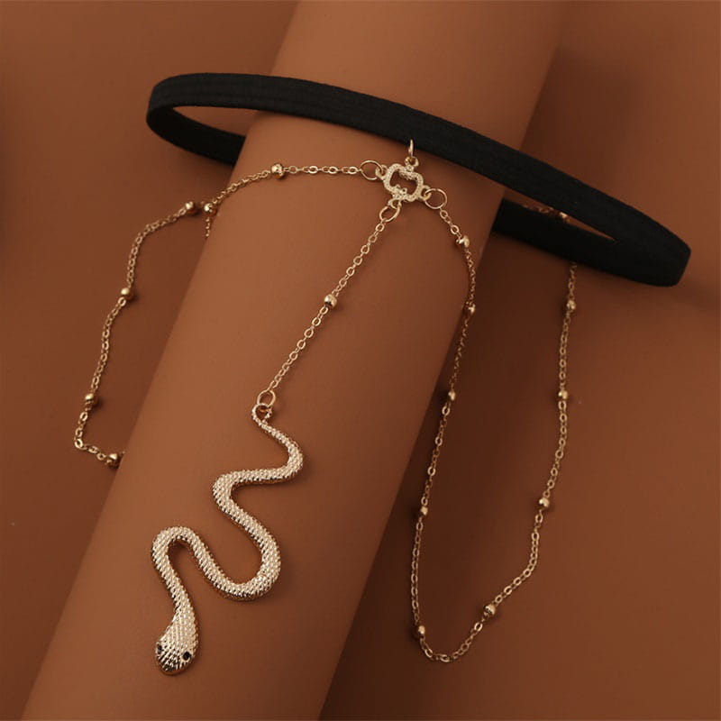 Bohemian boho gold big snake leg chain jewelry featuring a gold-toned snake-shaped anklet with textured beaded chain and ornate clasp.