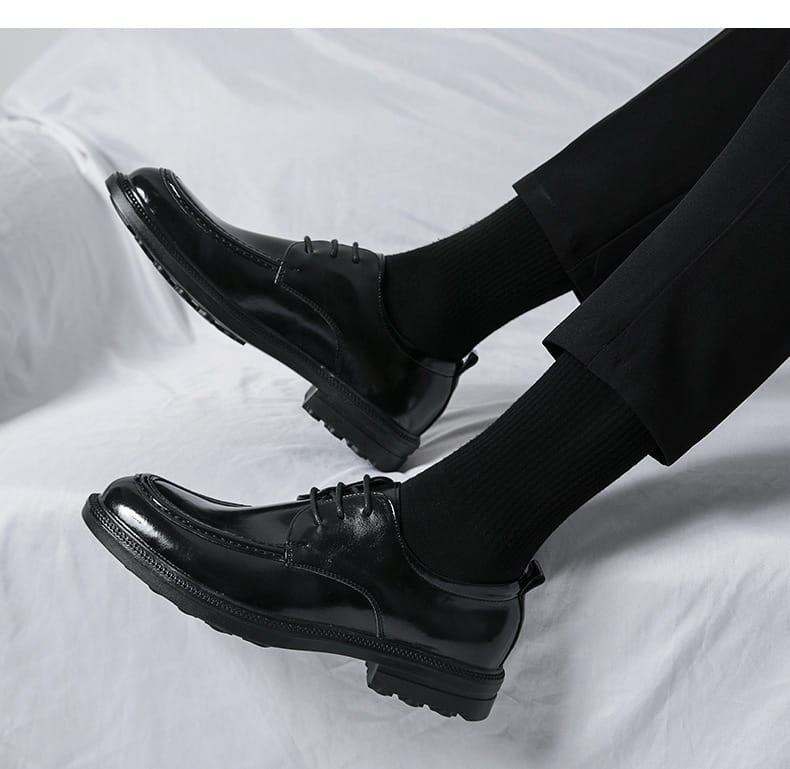 black patent leather lace-up oxford shoes with a glossy finish and textured rubber soles ideal for male fashion formal wear and horsebit loafers male style.