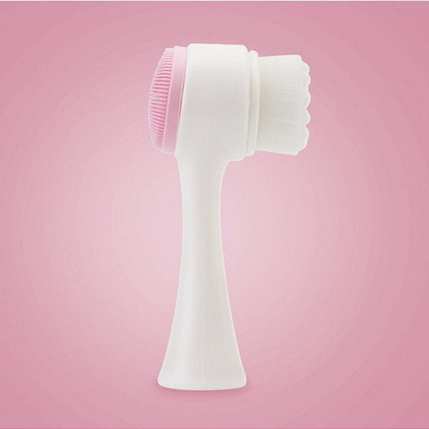 Dual sided silicone beauty skin care face wash is a white and pink cleansing instrument with a dual-sided design for gentle exfoliation and skin care face use.