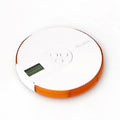 7 compartment white and blue alarm clock pill dispenser with white and orange circular pill box and digital dosage display