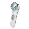 White 7 in 1 led facial machine and skin care massager with circular head featuring blue led lights and silver accents