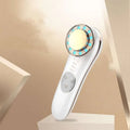 White 7 in 1 led facial machine and skin care massager with circular head featuring blue led lights and gold-toned center
