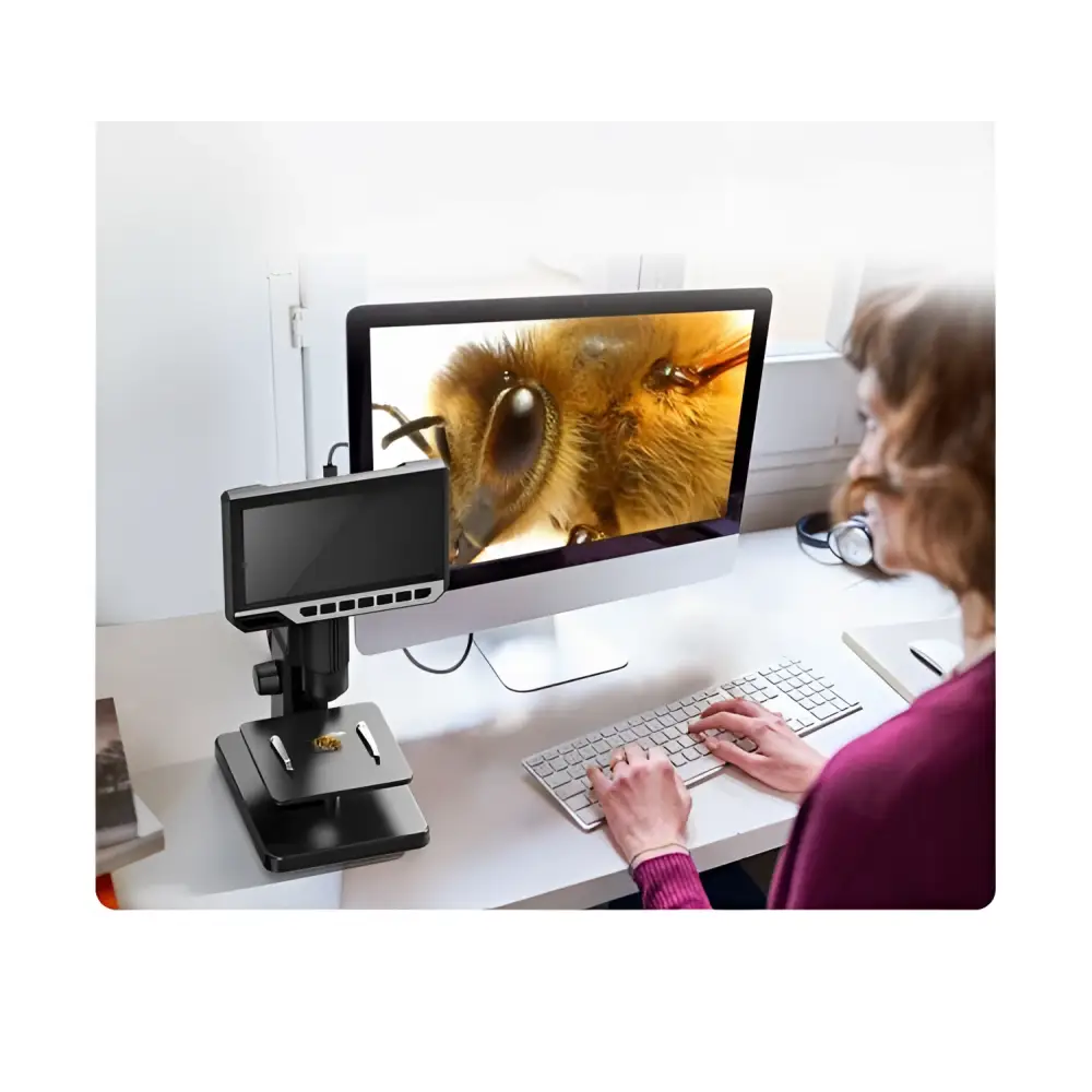 Black 7 inch hd touchscreen digital microscope royale essence lux with adjustable focus knobs displaying bee eye on imac