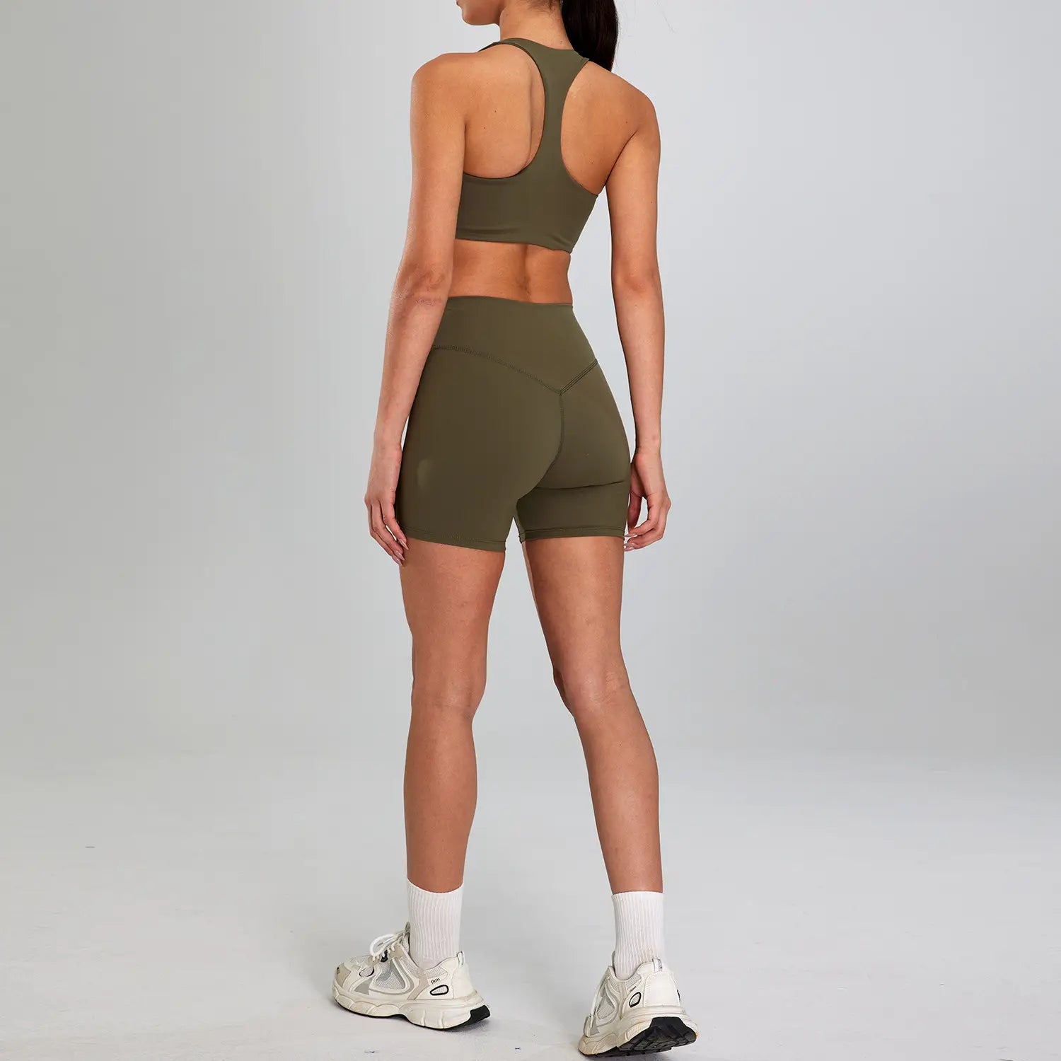 olive green seamless athletic two-piece sports suit outdoor designed for outdoor running nude activities featuring high waist for enhanced support and comfort