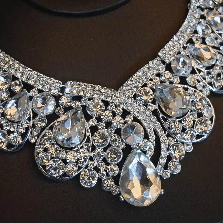 a sparkling silver bridal headdress flowers necklace adorned with clear teardrop and round crystals in an intricate ornate metal design for headdress flowers wedding and flowers wedding hair use