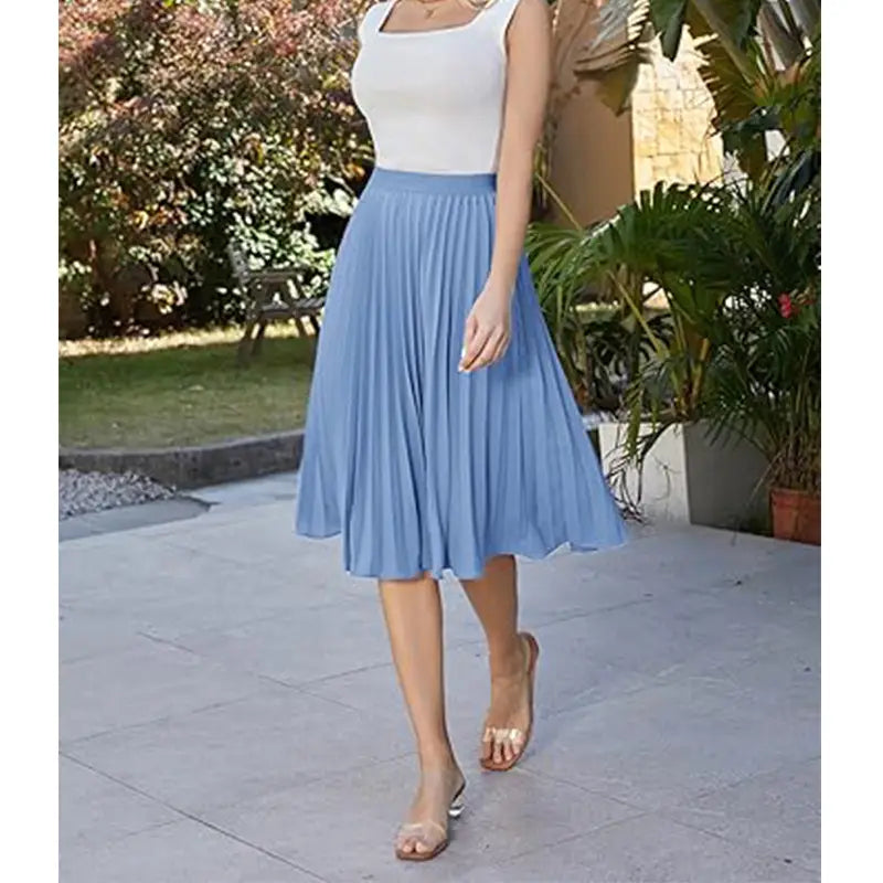 A light blue pleated large swing casual skirt made of soft flowing fabric with a flattering a-line silhouette.