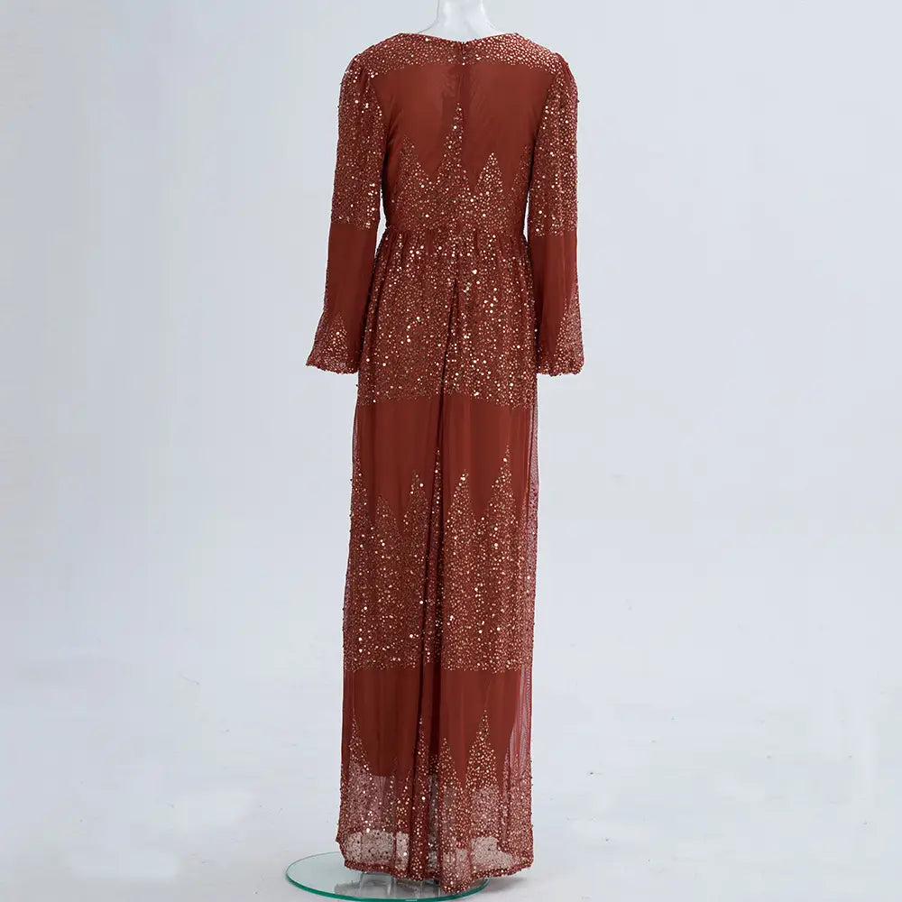 A rust bell sleeve sexy long sequined gown featuring intricate sequin detailing along the bodice and skirt for elegant evening wear.