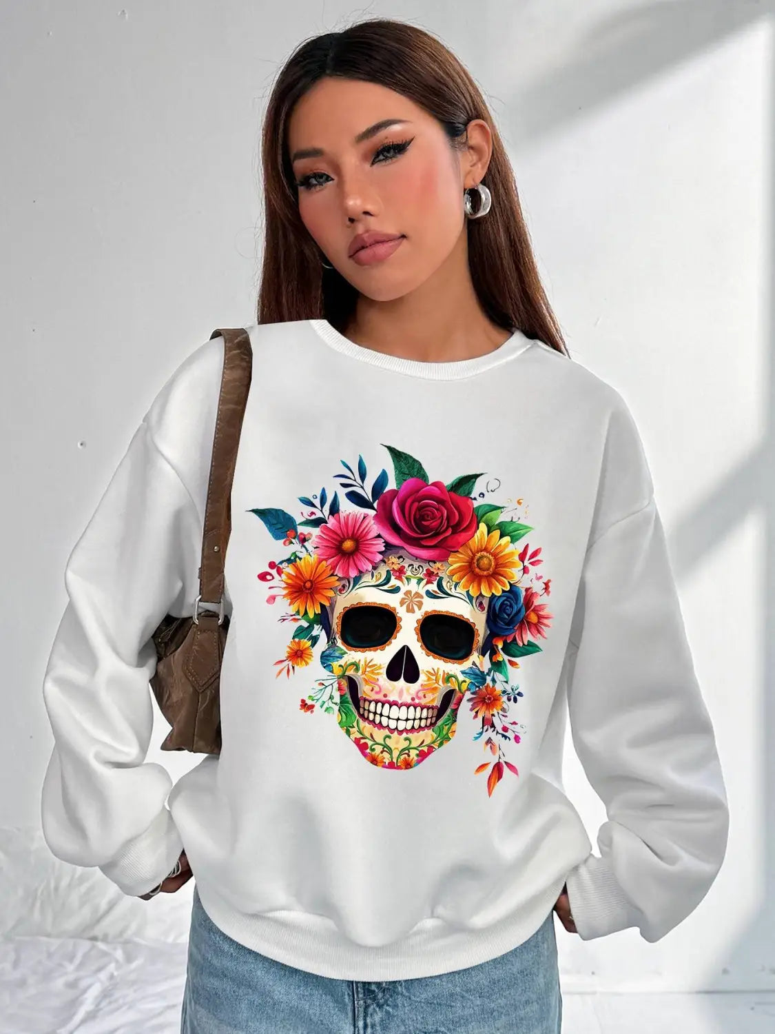 white long-sleeved crew neck sweatshirt featuring a vibrant colorful floral skull design suitable for daily wear basic long sleeve attire