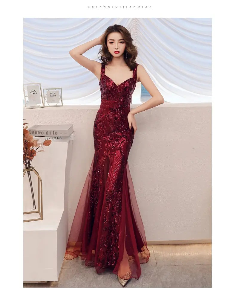 a shimmering burgundy fishtail long summer gown with intricate sequin embroidery and a sheer overlay designed as an elegant summer sequins sling evening dress