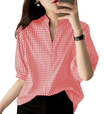 A loose casual half sleeve pink and white checkered blouse with a v neckline and three quarter sleeves.