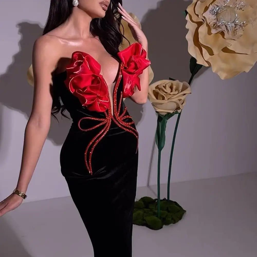 black velvet strapless gown with bold red satin ruffle embellishments and glittery gold trim from the white temperament socialite flower chain evening dress collection