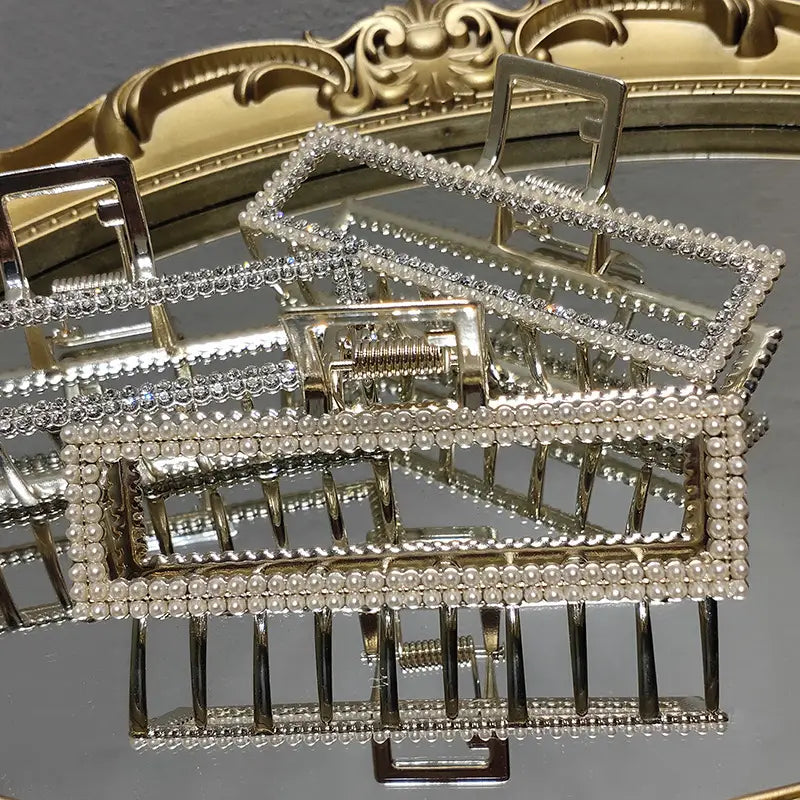 Elegant sweet pearl silver claw clip featuring silver and pearl-embellished rectangular hair clips with a sparkling ornate design.