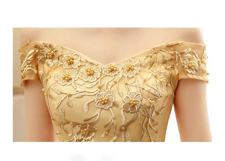 A delicate gold lace solo performance costume bodice adorned with intricate floral embroidery and small pearl-like beads for a performance costume tutu.