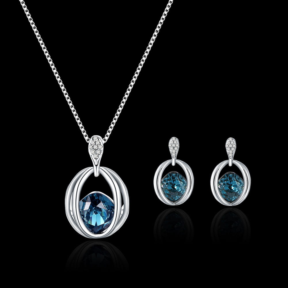 Silver necklace and earrings set featuring oval-shaped blue gemstones in sleek interlocking silver frames with diamond accents designed as a crystal bridal necklace with fashion inlaid crystal elements.