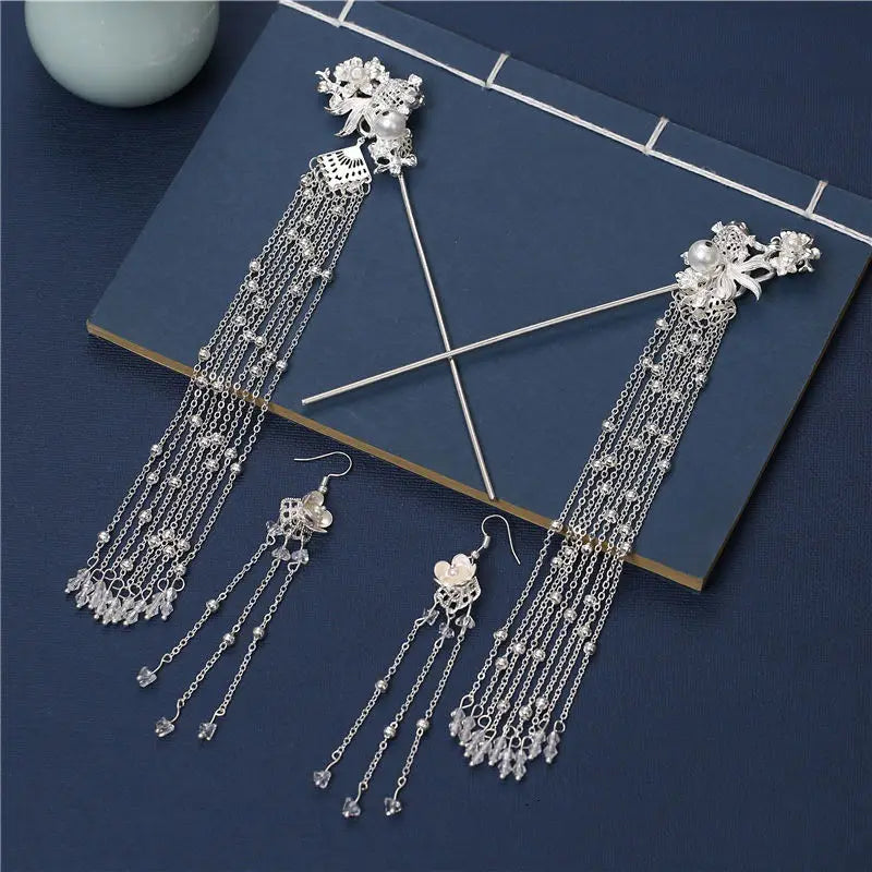 Elegant silver shaking hairpin ancient style set featuring intricate floral designs and cascading crystal chains paired with matching heart-shaped drop earrings.